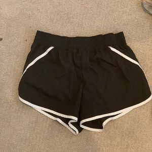 Running shorts with built in zipper pocket